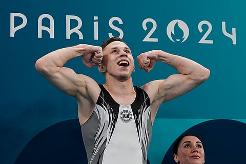 Ivan Litvinovich celebrates after winning the gold medal 